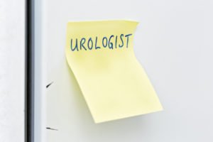 urologist reminder written on a post-it note