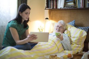 Social worker is visiting a senior woman at home