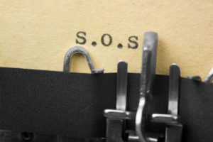 S.O.S. in old typewriter