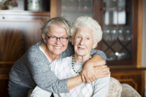 senior aging at home with help from family caregiver