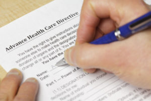 person filling out an advanced health care directive