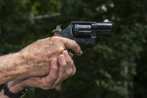 Senior with dementia holding a firearm